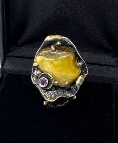 Artisan Baltic Amber RingHand-made Sterling Silver, 24k Gold, size 12Stones used: Baltic Amber, AmethystFace of the ring:  Height – 40mm, Width-30mm                                       Height – 1 1/2”, Width-1 1/4”                            Band height - 8mmUnique Handcrafted One-of a-kind Design RingEach Piece of Jewelry in my Collection is Absolutely One of a Kind!When you start wearing a piece of my jewelry you will fall in love with it more and more each day and feel that good Energy and Luxury Polished Opal Ring For Gift, Yellow Gold Fusion Style Rings For Gift, Unique Formal Polished Gemstones, Unique Polished Opal Ring For Collectors, Unique Amber Rings For Formal Occasions, Handmade Yellow Gold Amethyst Ring For Gift, Unique Citrine Ring In Yellow Gold, Handmade Heirloom Gold Opal Ring, Heirloom Style Amethyst Ring With Polished Finish