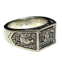 This is a perfect and unique style magic ring made of mixed magic metal by LP Duu in B.E. 2532 famous monk from Sakae Temple. The power of the ring is to protect all dangers including ghost, evils and devils and the ring can bring good luck, fortune, abundance to the wearer. The ring showcases an elegant design with unique holy amulet. It is great to get this ring for your loved one or treat yourself for a classic timeless style. Amulet Name: LP Duu Ring B.E. 2532 from Sakae Temple Ring details: Mantra Ring, Thai Pattern, Timeless Classic Style, Magic Ring, Mantra, Engraved Rings, Types Of Metal, Rings Statement, Temple