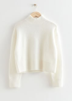 Cropped mock neck knit sweater featuring a cropped, boxy silhouette.– Ribbed collar, cuffs and hemline– Certified according to the Responsible Mohair Standard (CU810300)– Certified according to the Responsible Wool Standard (CU810300)Length of sweater: 51cm / 20.1" (Size S) Camel Winter Coat, Wineries Outfit, High Boots Outfit, Trouser Outfits, Ribbed Turtleneck Sweater, Ribbed Turtleneck, Sweater White, White Sweater, Cool Sweaters