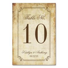 an old fashioned table number sign with the numbers ten and twenty on it's side