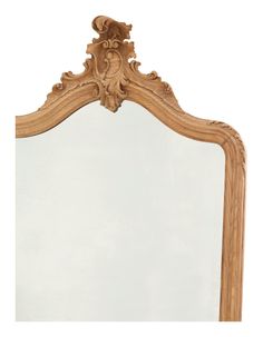 an ornate wooden frame mirror on a white background