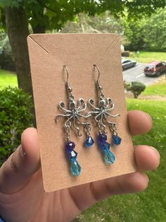 Octopus charm drop earrings with blue glass dangling drips Droplet Earrings, Simple Earrings, Blue Glass, Octopus, Jewelry Earrings Dangle, Etsy Earrings, Dangle Drop Earrings, Dangle Earrings, Etsy Accessories