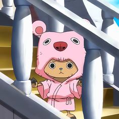 a cartoon bear in a pink outfit standing on some stairs with his hands behind his back