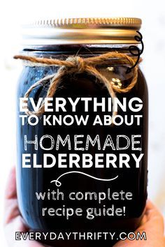 a hand holding a mason jar with the words everything to know about homemade elderberry