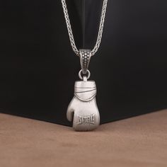 Single Boxing Glove Pendant in Sterling Silver, Fist Shaped Boxing Symbol Necklace,  Unique Sports Lover Necklace, Unisex Sportswear Jewelry  ✅ Beautifully crafted pendant  ✅ High-quality materials for durability  ✅ Detailed and intricate design pendant necklace  ✅ Makes a thoughtful gift for someone special    ★Item Details  * Gender: Male / Female  * Material: 925 Sterling Silver  * Finish: Oxidized / Polished / Gold Plated  * Pendant Weight: 13.25 Gram  * Pendant Diameter: 1.40 - 2.25 Cm0.55 Sport Jewelry, Box Symbol, Gloves Design, Sports Jewelry, Lovers Necklace, Think And Grow Rich, Symbol Necklace, Sports Lover, Boxing Gloves