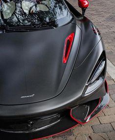 the front end of a black sports car