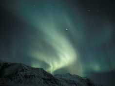 the northern lights shine brightly in the night sky