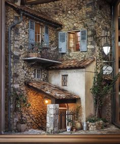 an image of a house with stone walls and balconies on the balconys