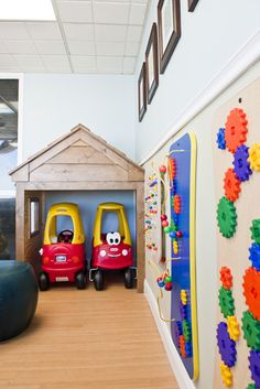 two children's toys are sitting in the playroom