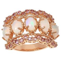 Colleen Lopez Opal and Pink Tourmaline Scalloped Wide Band Ring  This Colleen Lopez ring features stunning opals set on a wide band, plus pretty pink tourmaline stones along the scallop-edged design. Rose gold plating adds a touch of elegance to the already beautiful piece.       Approx. 5/8"L x 1"W x 3/16"H; shank 1/8"W     Stamped .925 sterling silver; rose gold plating   Stone Information       All sizes and weights approximate     White Opal - Oval (7x5mm)     Pink Tourmaline - Round; 1.12ct Pink Opal Ring Fine Jewelry, Pink Opal Jewelry With Gemstone Detail, Pink Opal Rings With Gemstone, Pink Opal Jewelry With Gemstone, Pink Opal Gemstone Rings, Famous Jewelry, Soft Life, Wide Band Ring, Color Bands