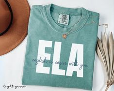 Are you looking for ELA Teacher Shirt? We got you! ✅ ABOUT OUR English Teacher Comfort Color T-shirt  ▸ 100% ring-spun US cotton for long-lasting comfort.  ▸  The garment is sewn around the finished edges with double stitching, making it long-lasting ▸  The garment is dyed after it's been constructed, giving it a soft color and texture ▸ Printed and shipped from the USA ✅ HOW TO ORDER your English Language Arts Teacher Shirt 1. Check our photos for sizing and color options. 📏 2. Choose your qua Casual Tops With Custom Text For School, Casual School Tops With Custom Text, School Cotton Tops With Custom Text, English Teacher Shirt, Language Arts Teacher, Photo Care, Ela Teacher, English Language Arts, Comfort Color