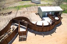 an aerial view of a fenced in area with animals