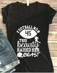 a t - shirt that says football mom this beauty raised her beast