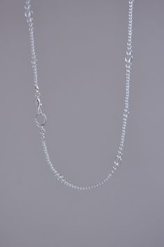 ------About this item------- * Versatility: This piece is designed with adaptability in mind, functioning both as a necklace and a bracelet. Its flexible length and simple clasp make it easy to transform, providing you with two elegant looks in one beautiful piece. * Gemstone: The necklace features premium white crystal beads, known for their clarity and light-reflecting properties, adding a touch of elegance and sophistication to the piece. * Material:  Accented with S925 sterling silver components, ensuring both durability and a timeless shine that complements the purity of the white crystal beads. * Design: The necklace showcases a minimalist design, with a delicate arrangement of crystal beads that provide a refined, translucent appearance. The design is understated yet sophisticated, Simple Link Chain Jewelry, Minimalist Adjustable Chain Necklace With Round Beads, Classic Adjustable Silver Chain Necklace, Simple Charm Necklace With Adjustable Chain, Minimalist Metal Necklaces With Round Beads, Adjustable Chain Necklace With Delicate Round Pendant, Minimalist Chain Necklace With Adjustable Chain And Round Beads, Adjustable Sterling Silver Charm Necklace With Chain, Minimalist Adjustable Round Bead Chain Necklace