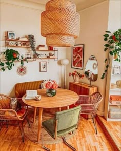 a living room filled with furniture and decor on top of hard wood floored floors