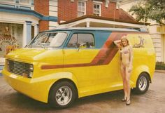 a woman standing next to a yellow van