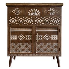 an ornate wooden cabinet with geometric designs on the doors and drawers, painted in brown