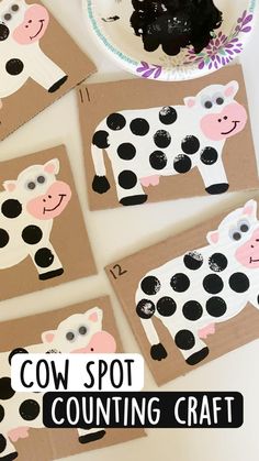 some paper plates with black and white cows on them