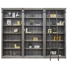 an old bookcase with ladders and shelves full of books on the top shelf