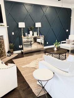 a living room filled with furniture and a fire place in front of a mirror wall