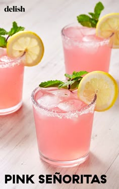 three glasses filled with pink lemonade and mint garnish