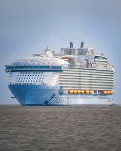 a large cruise ship in the ocean on a clear day with no people around it