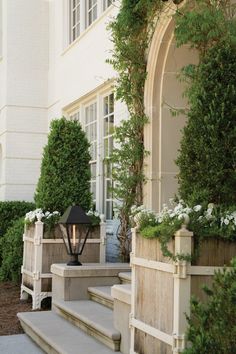 an outdoor area with steps and planters