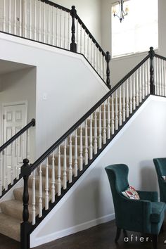 two chairs are sitting in front of the stairs