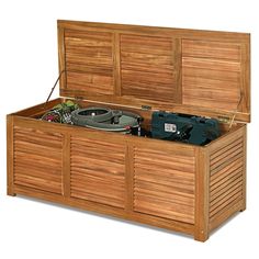 a large wooden box with two drawers and a record player in the bottom drawer,