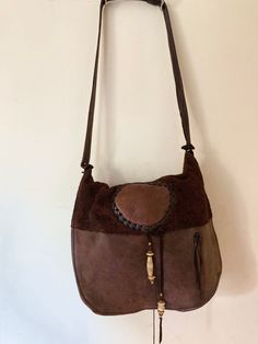 "Vintage Erda Leather Cross Body Messenger Bag - Shades of Brown Supple Deerskin Leather and Suede. In near perfect condition, one spot on front that is original to the leather...I can't find anything else wrong with it but please account for something minor Gorgeous Brown colors from a dark Fawn to a rich deep chocolate Brown. Closes with a flap. Back pocket the width of the purse. Nice detailing. Very clean inside. Made in the 70s or 80s give or take. Pretty clean inside. I don't think this ha Leather Shoulder Bag With Leather Handles, Suede Shoulder Bag With Leather Lining, Brown Leather Saddle Shoulder Bag, Brown Leather Hobo Shoulder Bag, Brown Textured Faux Leather Shoulder Bag, Brown Leather Trim Crossbody Saddle Bag, Brown Leather Backing Crossbody Shoulder Bag, Brown Leather Satchel Shoulder Bag, Brown Leather Lined Crossbody Shoulder Bag