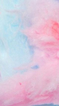 an abstract painting with pink, blue and white colors on it's surface is shown