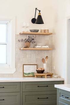 the kitchen counter is clean and ready to be used as a shelf for cooking utensils