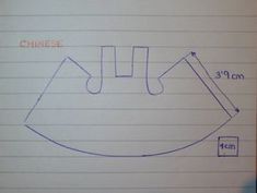 a drawing of a face drawn in blue ink on lined paper with the words chinese written below it