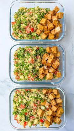 three glass containers filled with tofu and vegetables