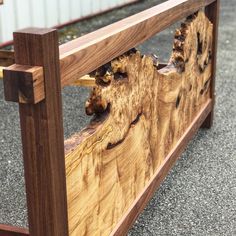 a close up of a wooden bench made out of wood