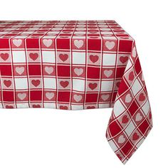 a red and white table cloth with hearts on it