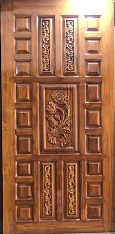 a wooden door with intricate carvings on it