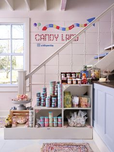 the shelves are filled with canned goods and condiments, along with an area rug on the floor