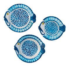 three blue and white fish shaped dishes