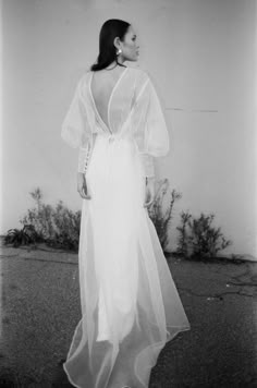 black and white photograph of woman in long dress