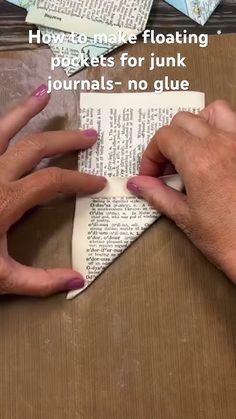 two hands that are on top of an open book with the title how to make floating packets for junk journals - no glue