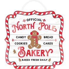 a sign that says north pole bakery with a gingerbread bear on the front and bottom