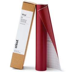 a red roll of paper next to a cardboard box