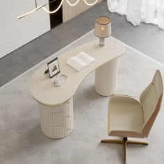 an office desk with a chair and lamp