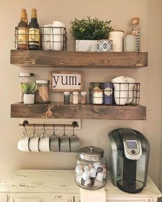 two wooden shelves with coffee cups and mugs on them, next to a counter