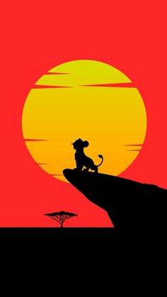 the lion king silhouetted against an orange and red sunset