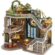 a doll house with stairs and lots of furniture on it's sides, including a staircase leading up to the second floor