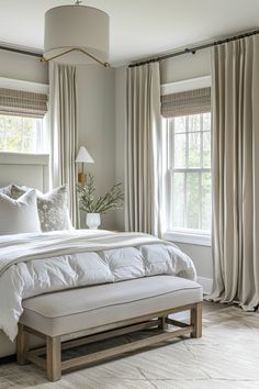 Bright bedroom with a plush bed, bench, and large windows draped with beige curtains. Neutral Bedroom Ideas, Reclaimed Wood Accent Wall, Bedroom Frames, Cabin Bedroom, Weathered Furniture, Neutral Bedrooms, Feminine Bedroom, Calming Bedroom, Neutral Room