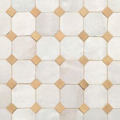 a white and brown tiled floor with small squares