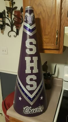 a purple cheetos party hat sitting on top of a counter in a kitchen